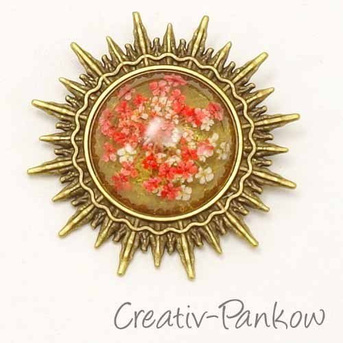 Bronzefarbene Cabochon Sonnen-Brosche "Rosa Trockenblumen"