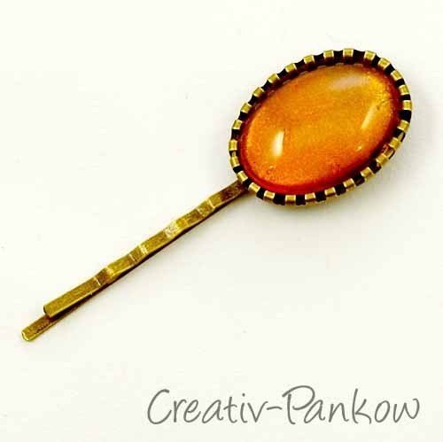Bronzefarbene ovale Cabochon-Haarklemme "Schillernd Orange"